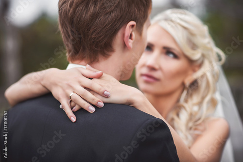 Wedding ring. Bride and groomin love photo