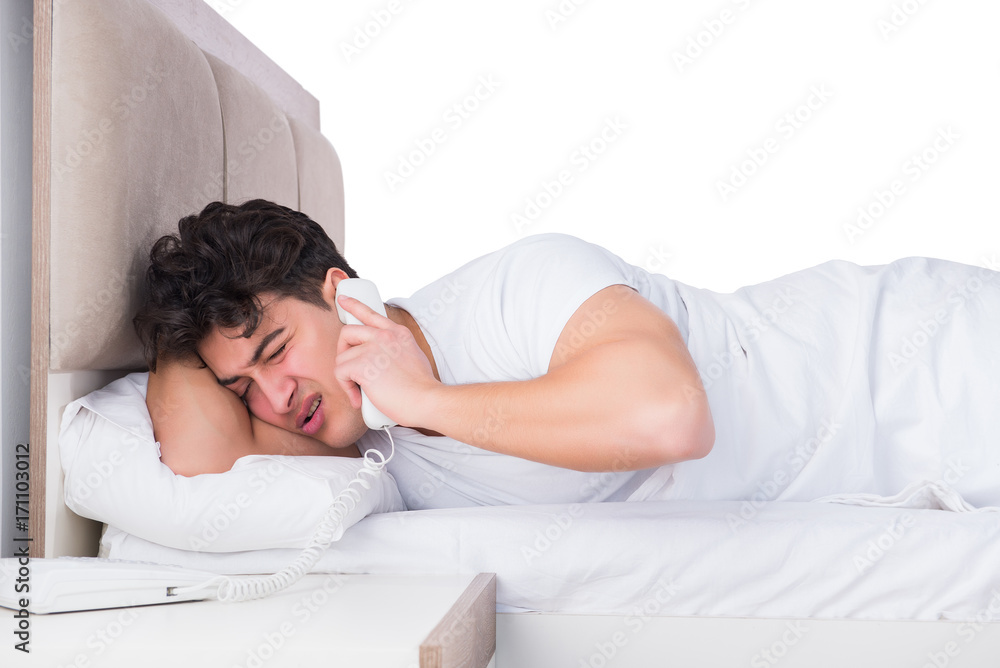 Man in bed suffering from insomnia Man in bed suffering from insomnia