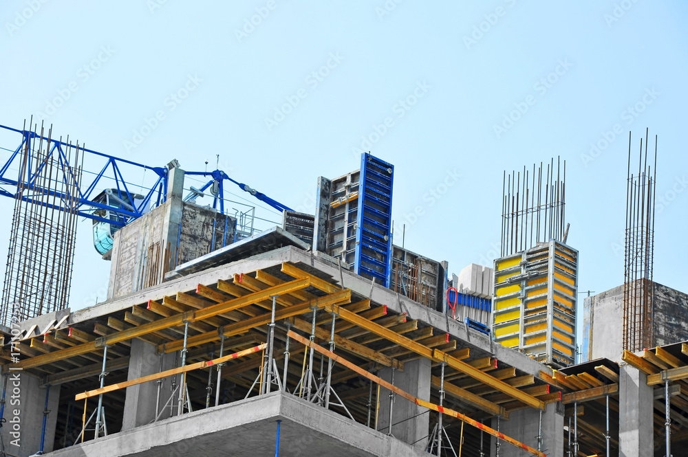 Crane and highrise construction site Crane and highrise construction site