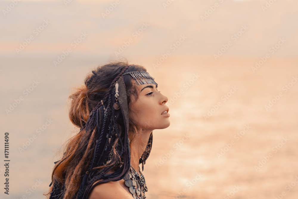 close up portrait of beautiful tribal woman dancer in headdress