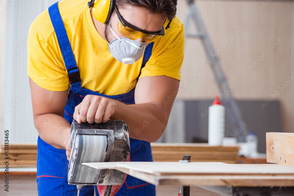 Fototapeta premium Carpenter working in the workshop