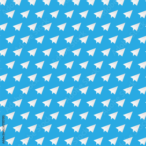 White paper plane on blue background pattern