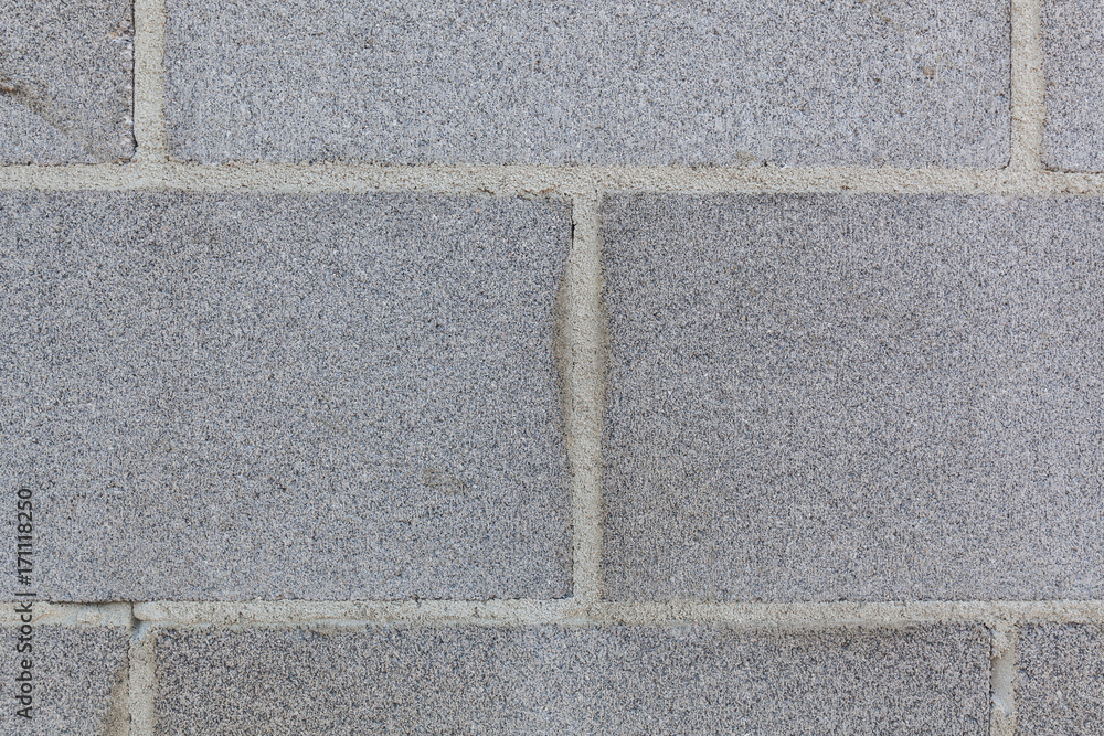 Fototapeta premium Clean and straight cinder block wall background texture closeup