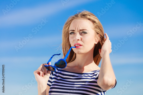 Girl enjoying summer breeze sky background