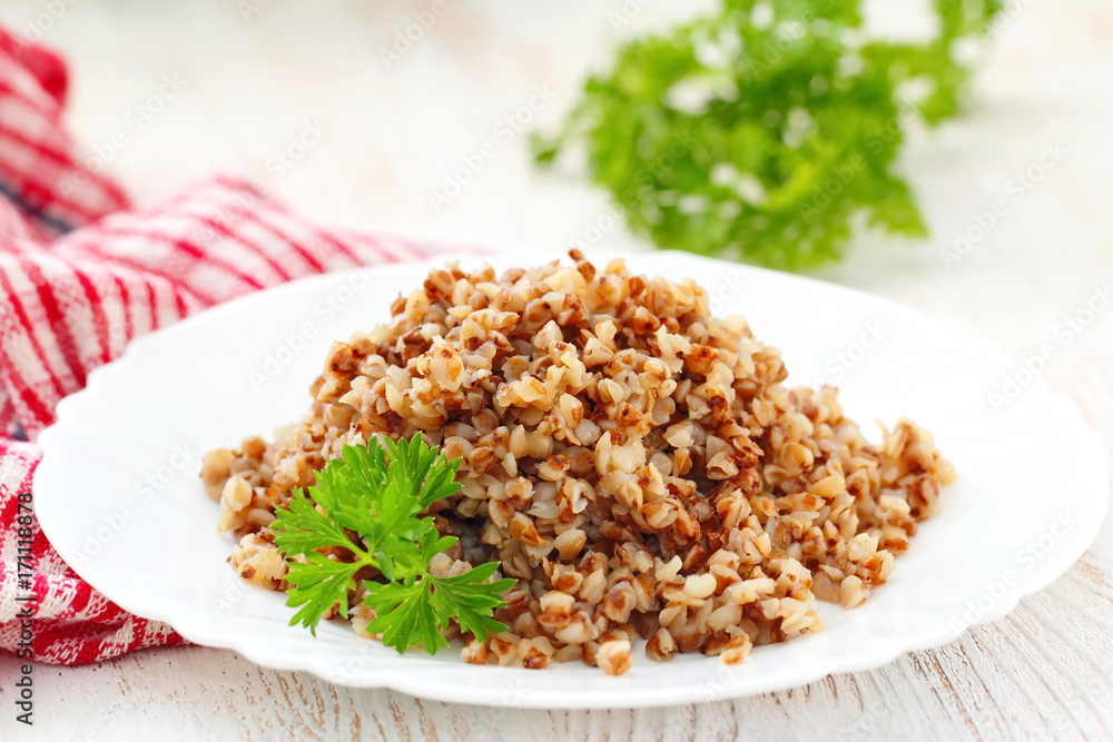 Buckwheat on a plate and fresh vegetables Buckwheat on a plate and fresh vegetables