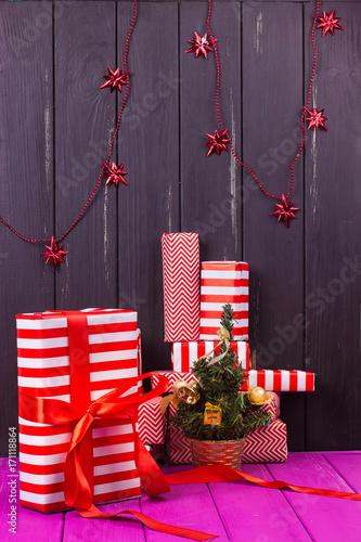 Gift boxes and small decorated Christmas tree