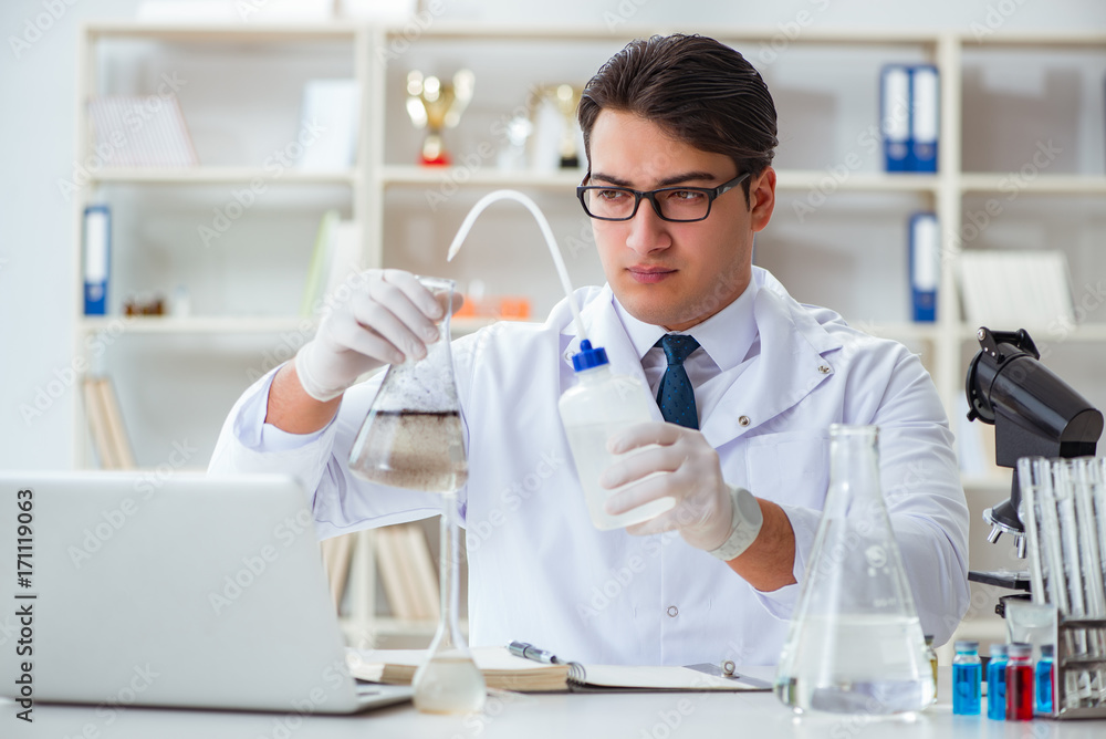 Young researcher scientist doing a water test contamination expe Young researcher scientist doing a water test contamination expe