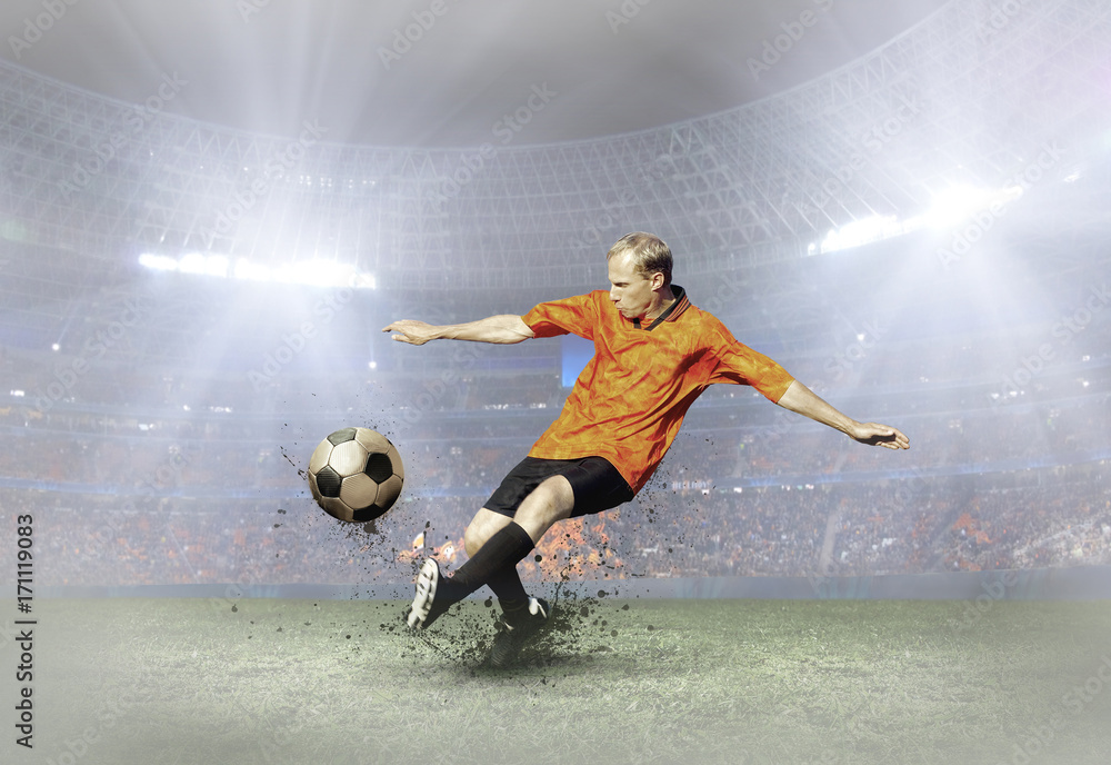 Soccer player with ball in action on field of stadium