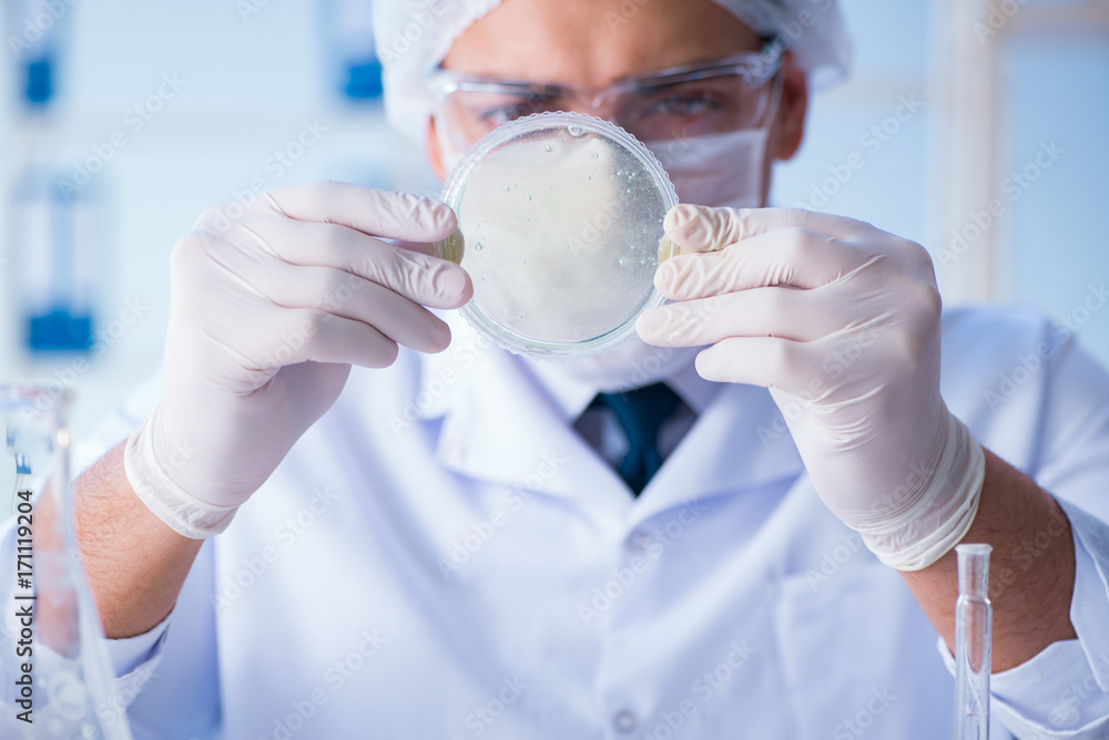 Female scientist researcher conducting an experiment in a labora Female scientist researcher conducting an experiment in a labora