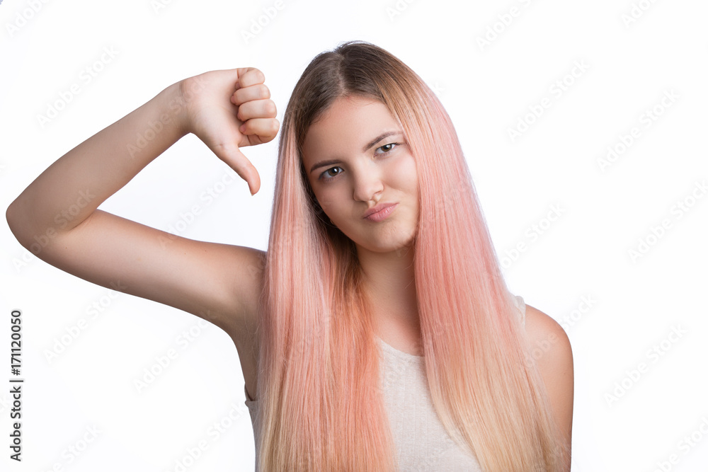 Young pretty woman showing thumbs down and bad dislike, gesture not ok Young pretty woman showing thumbs down and bad dislike, gesture not ok