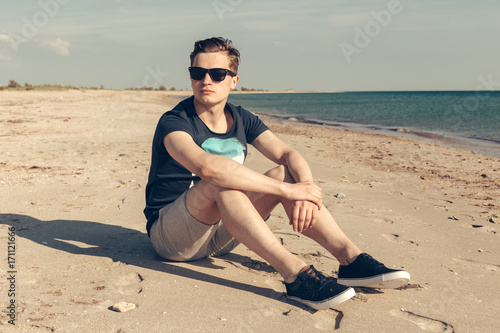 young handsome man on the beach