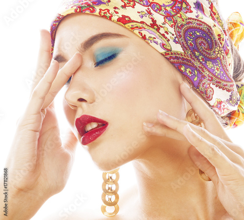 young pretty modern girl with bright shawl on head emotional posing isolated on white background, asian people ethnicity photo