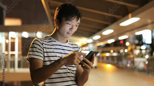 Canvas Print Man use of tablet computer at night
