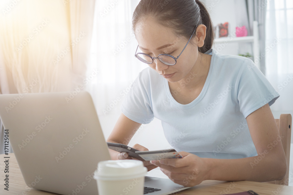 Asian woman using smartphone shop online by credit card. Asian woman using smartphone shop online by credit card.