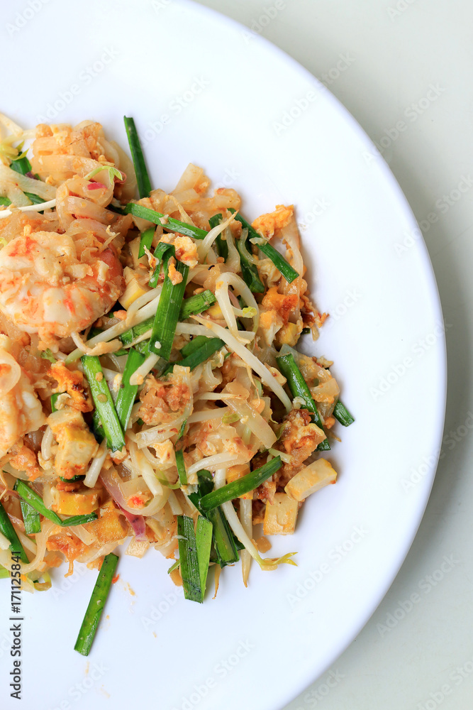 Thai food Pad Thai ,Stir fry noodles with shrimp in white plate. The one of Thailand's national main dish. the popular food in Thailand. Thai Fried Noodles.