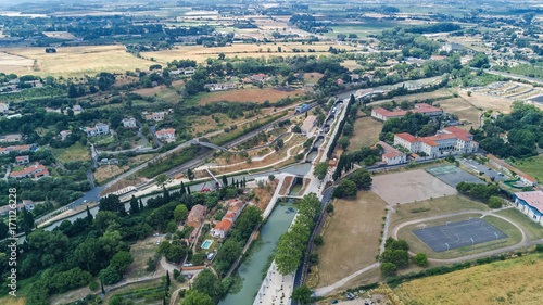 Aerial top view of Fonserannes locks on canal du Midi from above, unesco heritage landmark in France 