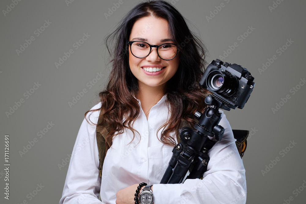 Female tourist with photo camera and travel backpack. Female tourist with photo camera and travel backpack.