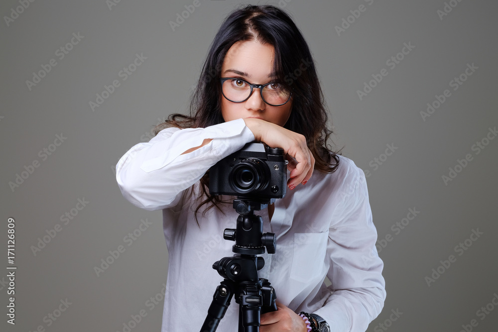 Female taking pictures with a professional photo camera. Female taking pictures with a professional photo camera.