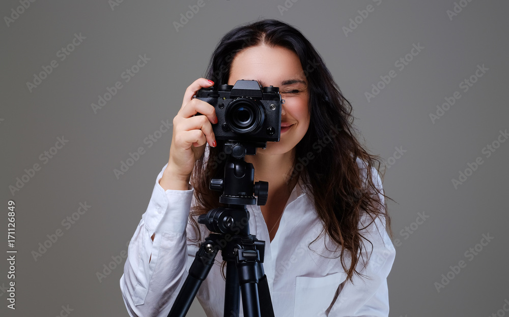 Female taking pictures with a professional photo camera. Female taking pictures with a professional photo camera.