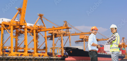 The engineer manages the cranes at the pier. © Cheangchai