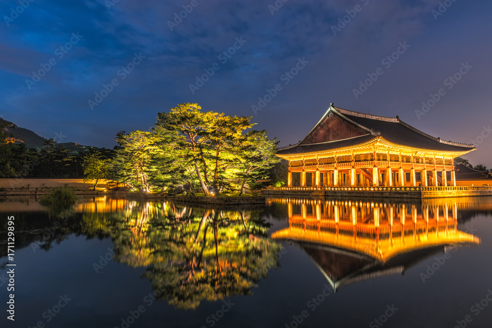Gyeongbokgung Palace At Night In South Korea, with the name of the palace 'Gyeongbokgung' on a sign Gyeongbokgung Palace At Night In South Korea, with the name of the palace 'Gyeongbokgung' on a sign