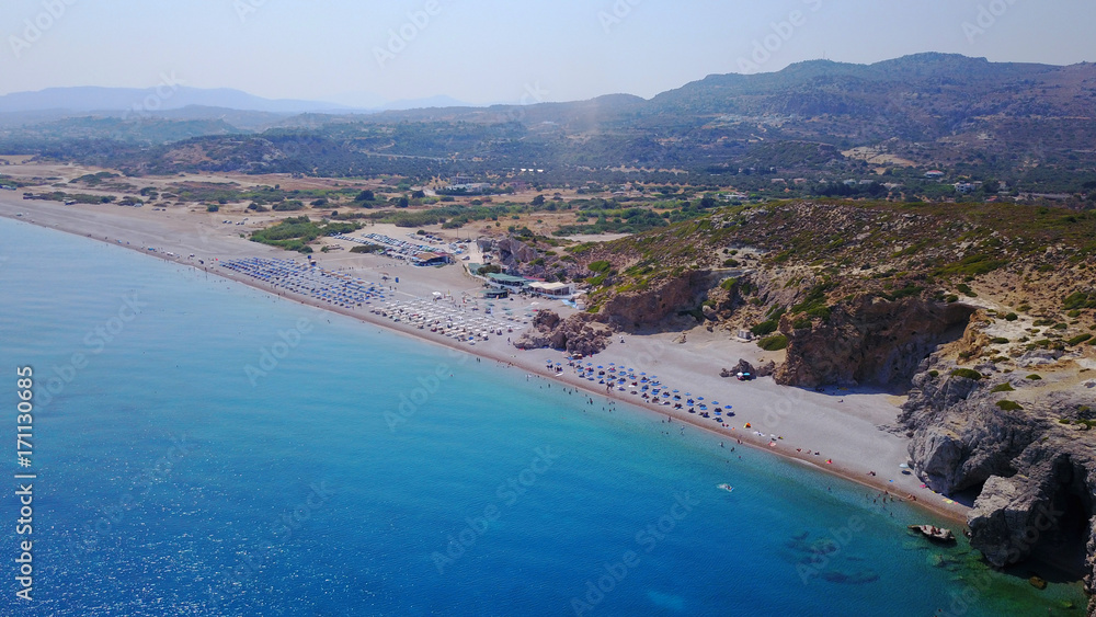 August 2017: Aerial drone photo of paradise beach of Traganou with small caves and turquoise clear waters, Rhodes island, Dodecanese, Aegean, Greece