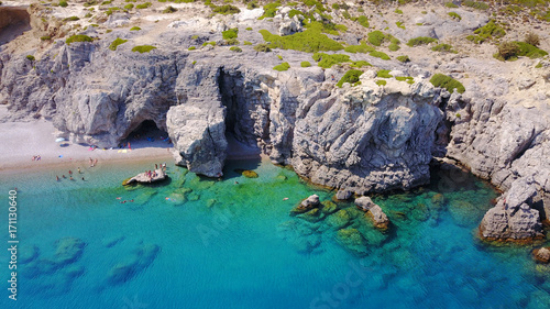 August 2017  Aerial drone photo of paradise beach of Traganou with small caves and turquoise clear waters  Rhodes island  Dodecanese  Aegean  Greece