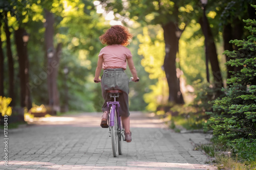 Wallpaper Mural Beautiful young woman with bicycle, outdoors Torontodigital.ca