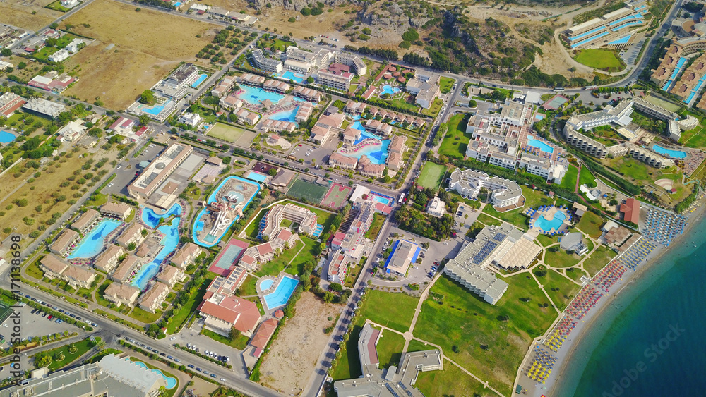 August 2017: Aerial drone photo of famous pools and 5 star resorts - hotels at small village of Kolympia bay, Rhodes island, Aegean, Dodecanese, Greece