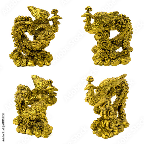 Statuettes of gold pheasants isolated on a white background