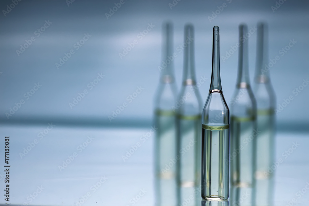 transparent vials of medicine transparent vials of medicine