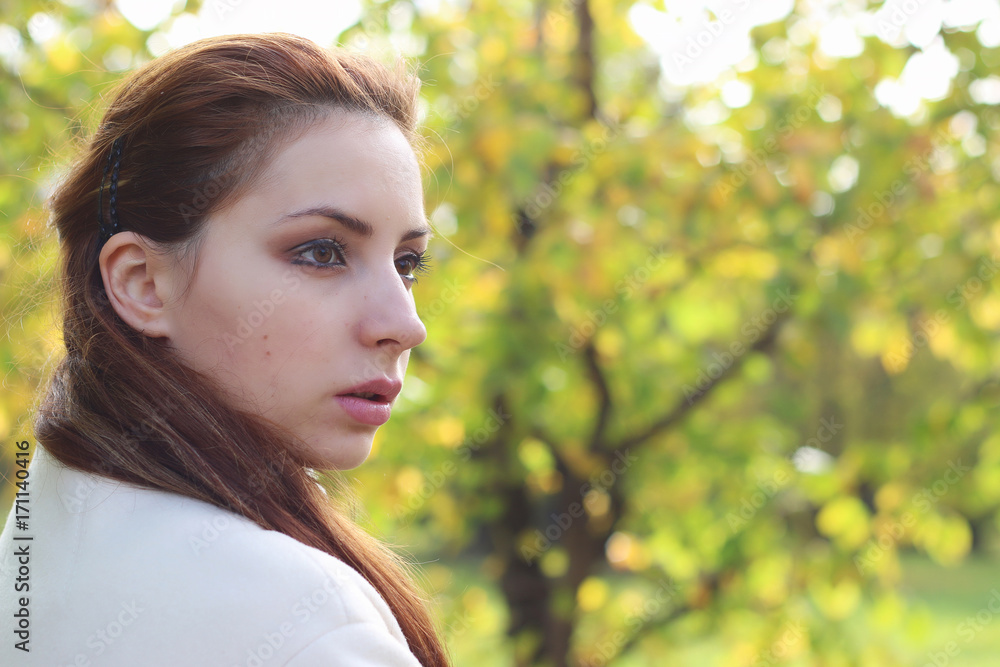 girl walking in the park in autumn girl walking in the park in autumn