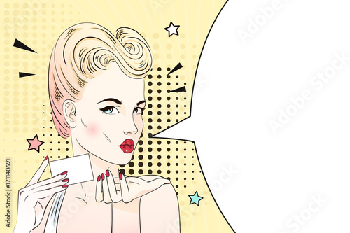 Pop art blonde woman with retro hairstyle sends an air kiss and holds visit card. Comic woman with speech bubble. Vector illustration.