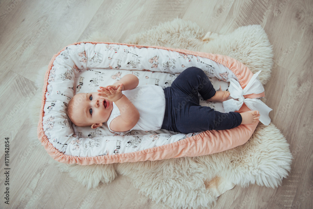 Bedding for children. The baby sleeps in bed. A healthy little baby soon after birth. Bedding for children. The baby sleeps in bed. A healthy little baby soon after birth.