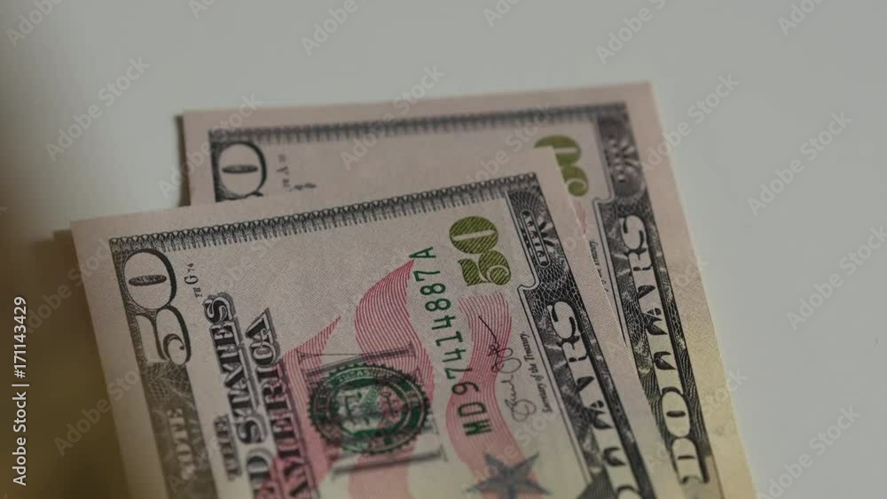 Counting Banknotes Of Us Dollars On White Desk Counting Banknotes Of Us Dollars On White Desk