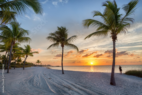 Photographer at sunrise on the Smathers beach - Key West  Florida