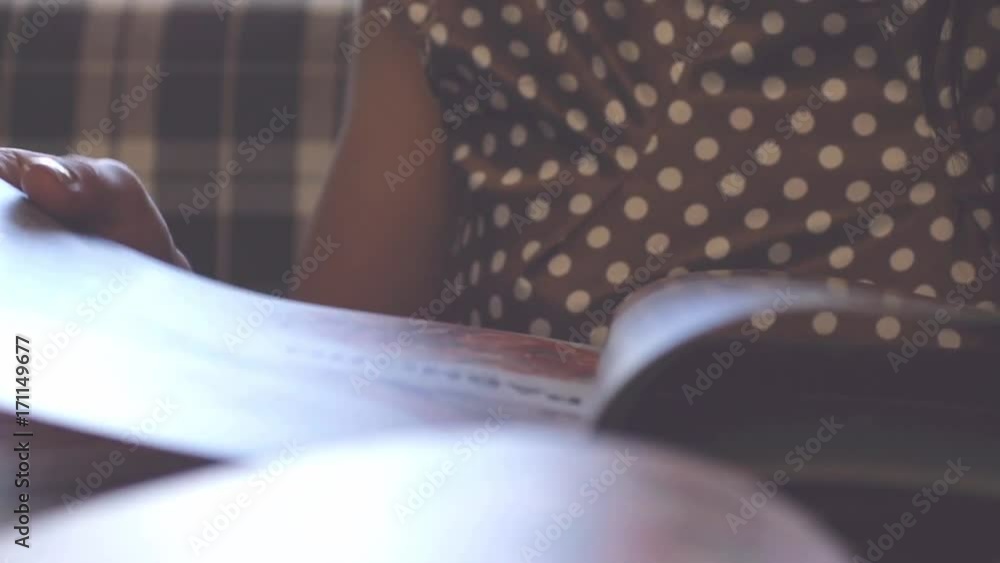 Woman is looking the menu at the restaurant on blurred bokeh background in slow motion. 1920x1080 Woman is looking the menu at the restaurant on blurred bokeh background in slow motion. 1920x1080
