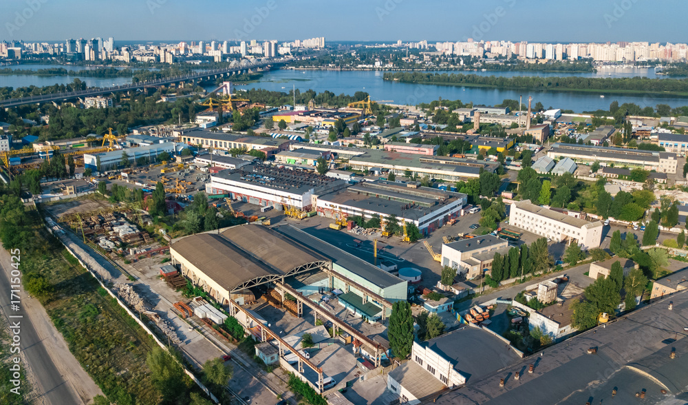 Aerial top view of industrial park zone from above, factory chimneys and warehouses, industry district in Kiev (Kyiv), Ukraine
