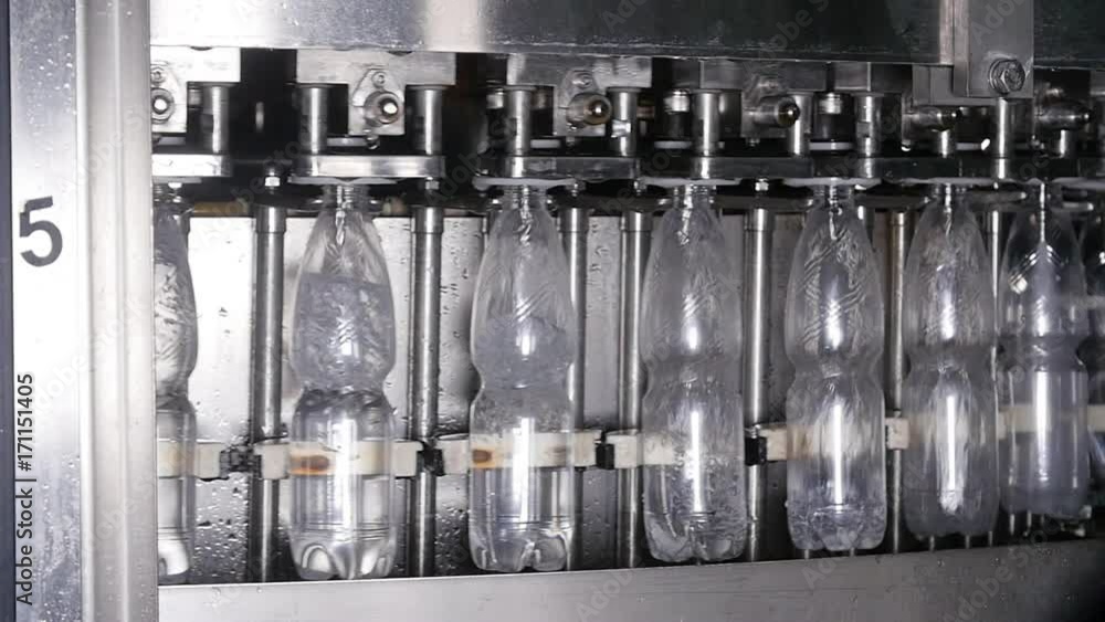 Bottle filling with water at factory Bottle filling with water at factory