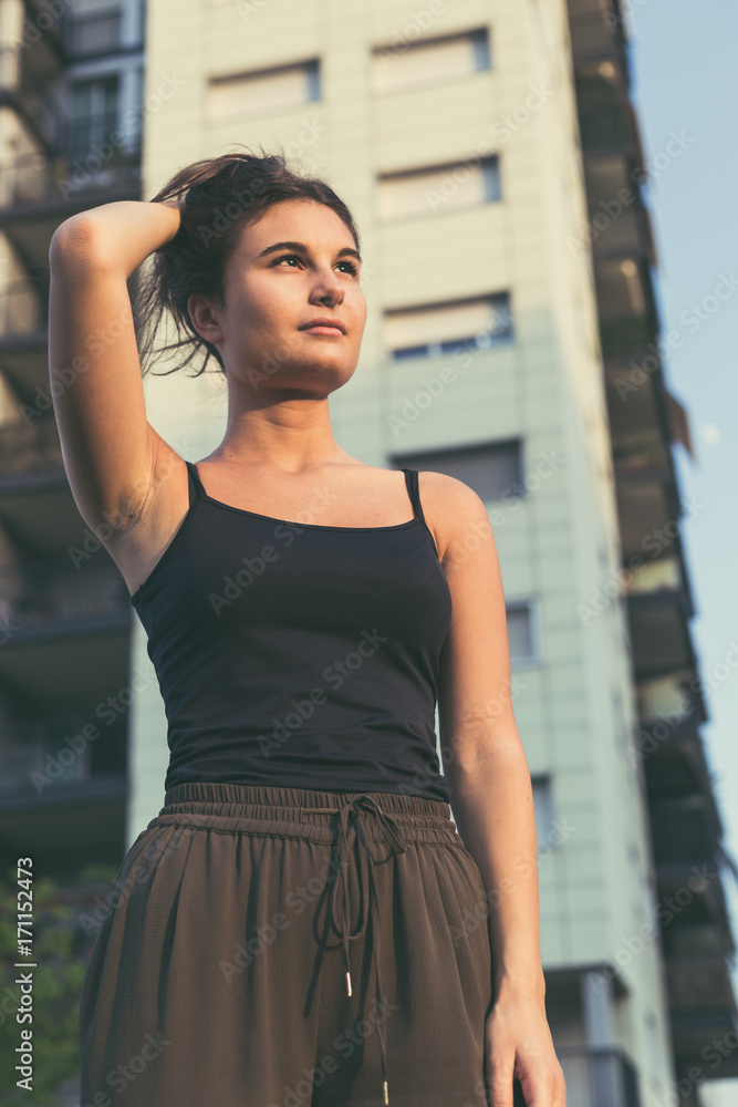 Young woman posing in an urban context Young woman posing in an urban context