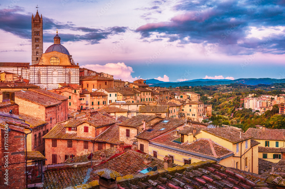 Beautiful stunning panoramic view of historical part of medieval town of Siena in the morning in Tuscany, Italy