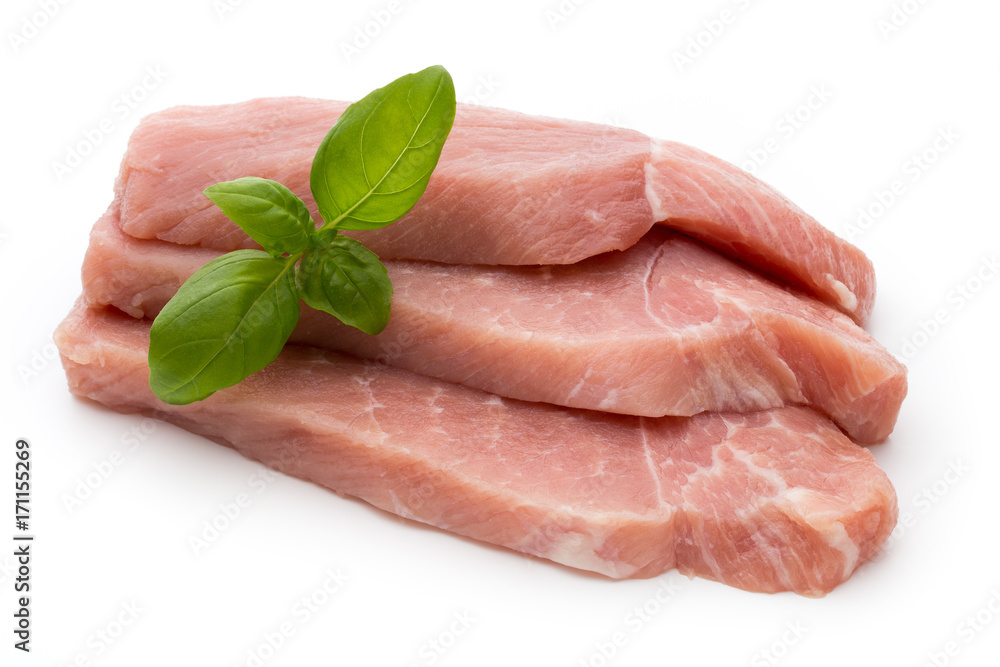 Fresh pork fillet with basil on a white background. Fresh pork fillet with basil on a white background.