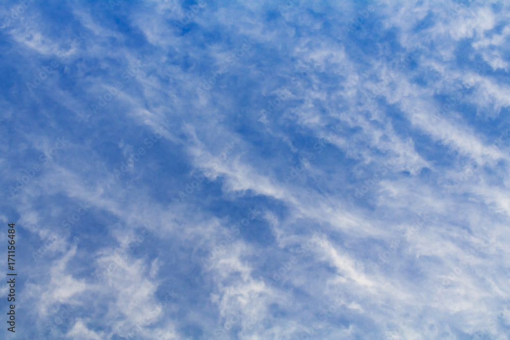 White clouds against the blue sky (background)