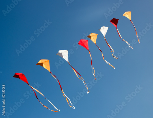 Colorful kites in a row photo