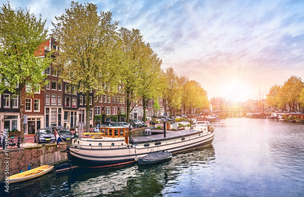 Channel in Amsterdam Netherlands houses river Amstel landmark
