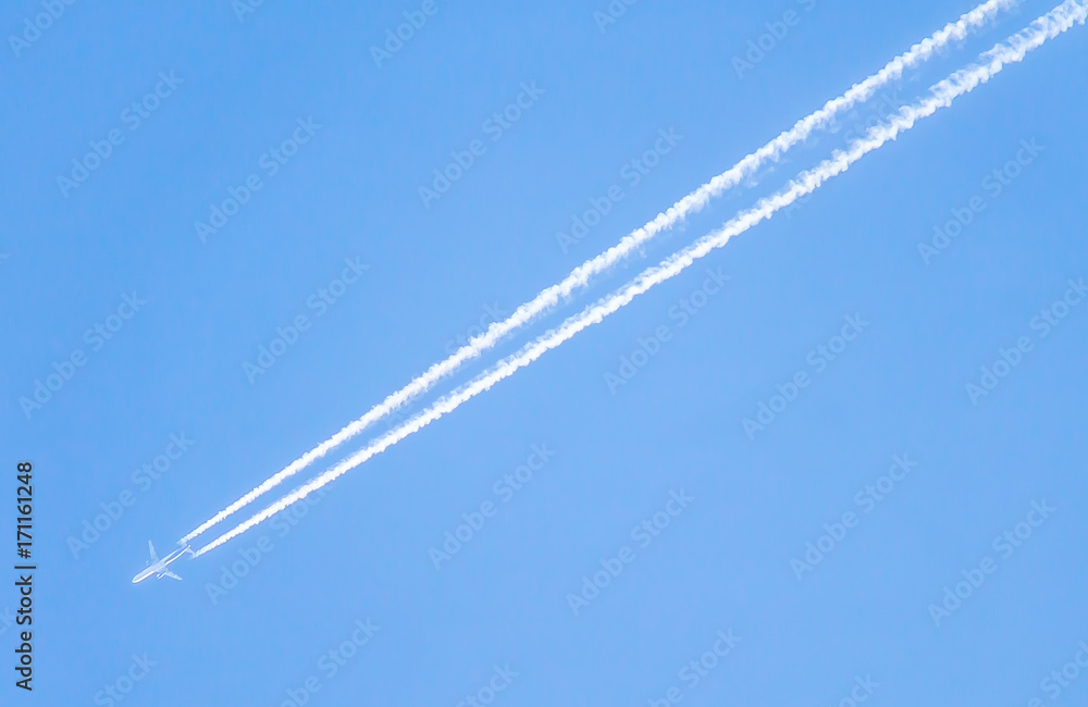 A trace in the sky from a flying airplane A trace in the sky from a flying airplane