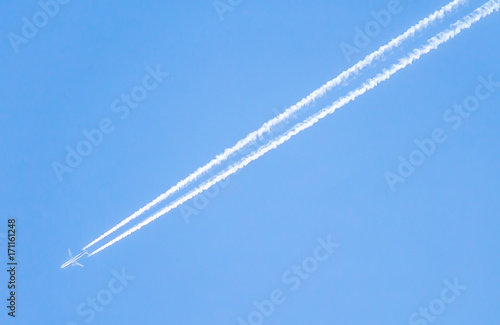 A trace in the sky from a flying airplane © kvdkz