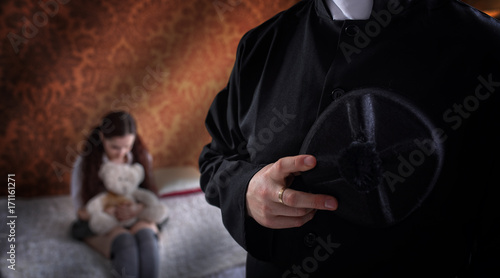 Cleric and crying child