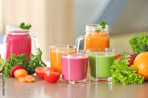 Fresh juices and ingredients on table