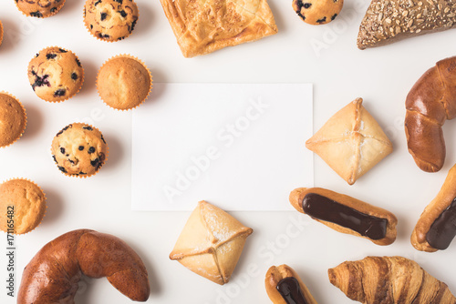 Fototapeta various types of pastry and blank card